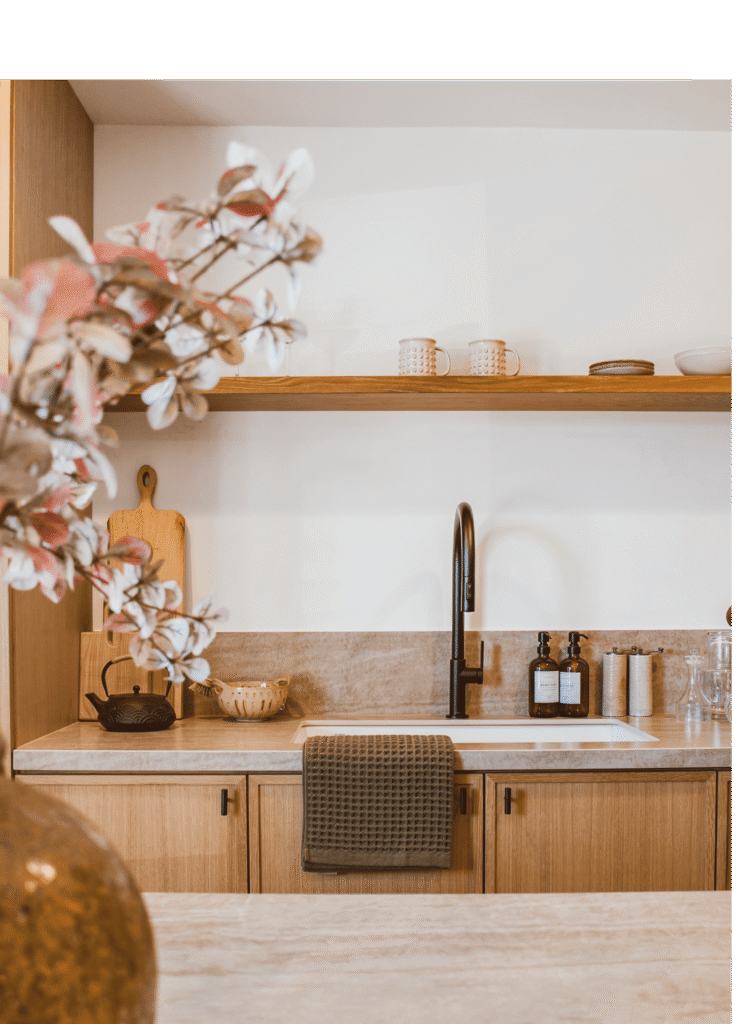 kitchen-sink-cabinet Kitchen with a sink & wooden cabinet & hand towel hanging