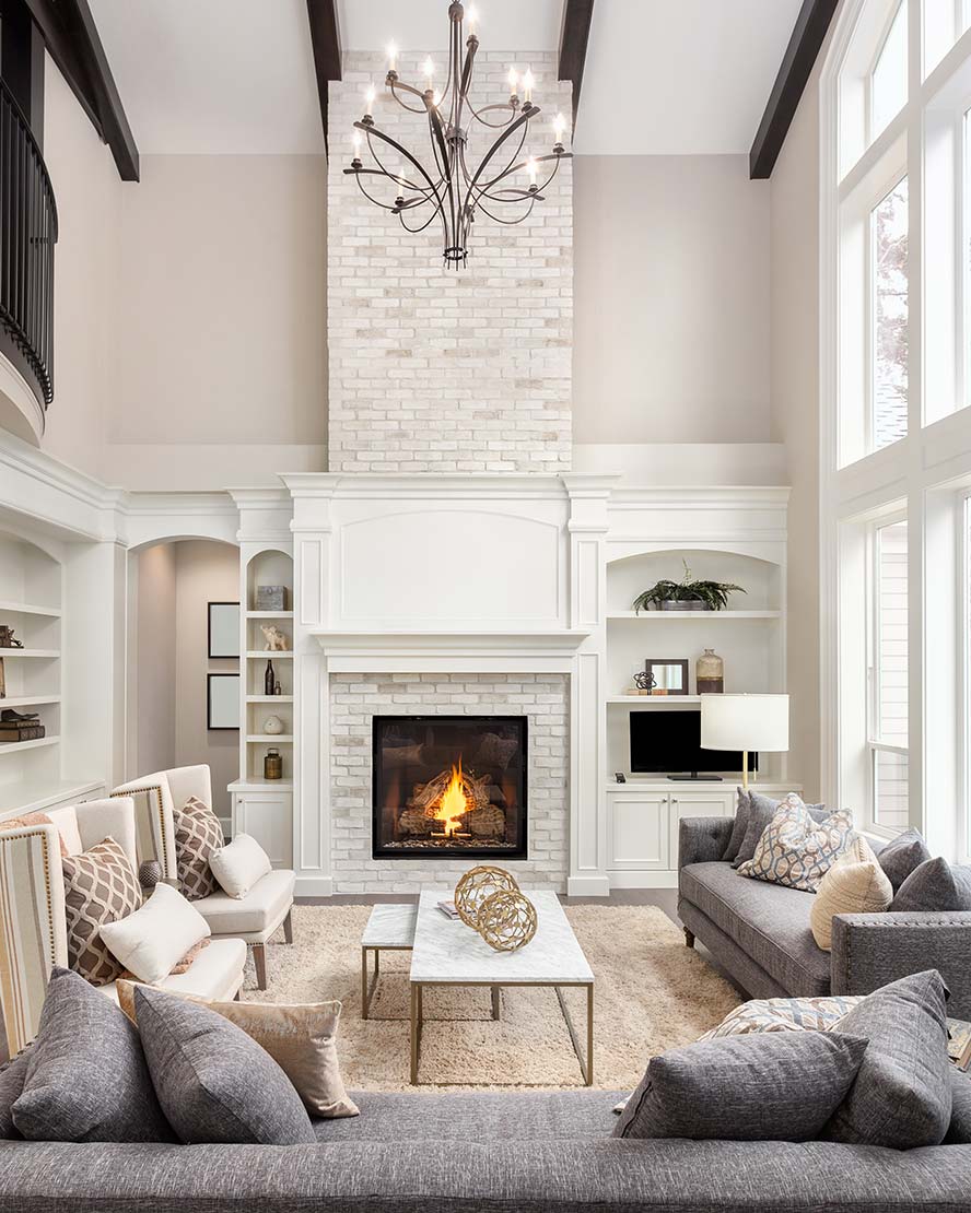 A modern, renovated living room with a fireplace
