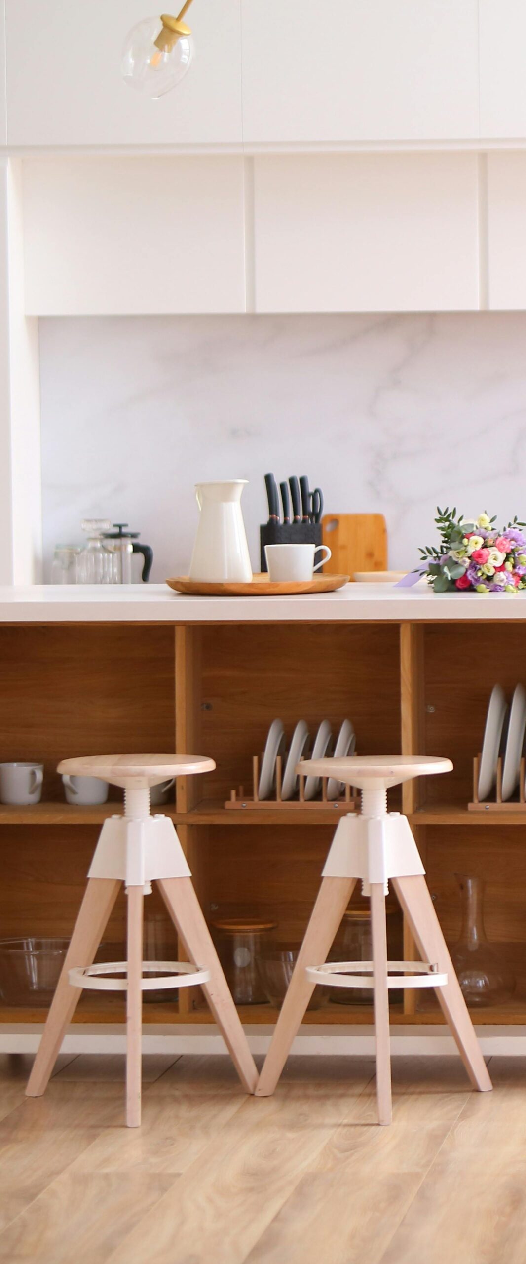 White & brown wooden chairs with a wooden shelf