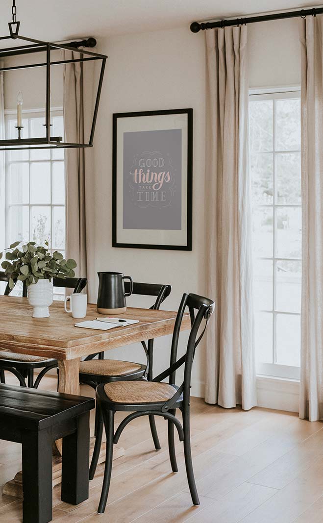 Brown wooden dining table with windows