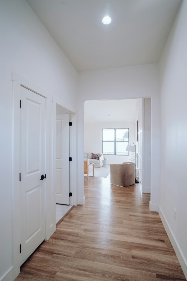 Home remodel hallway with wood flooring