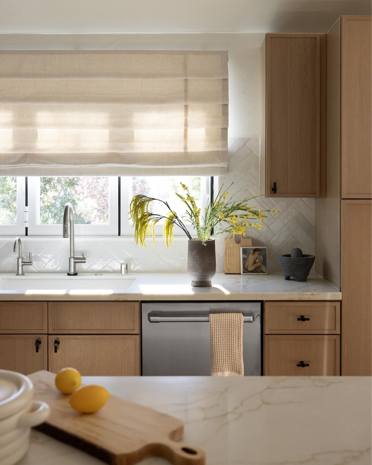 Remodeled kitchen with lemons on a cutting board.