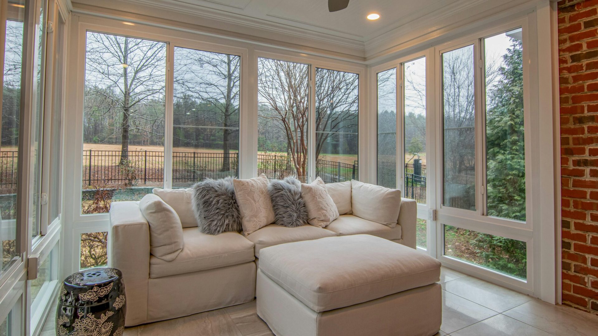 White sofa & glass windows inside a modern guest ADU