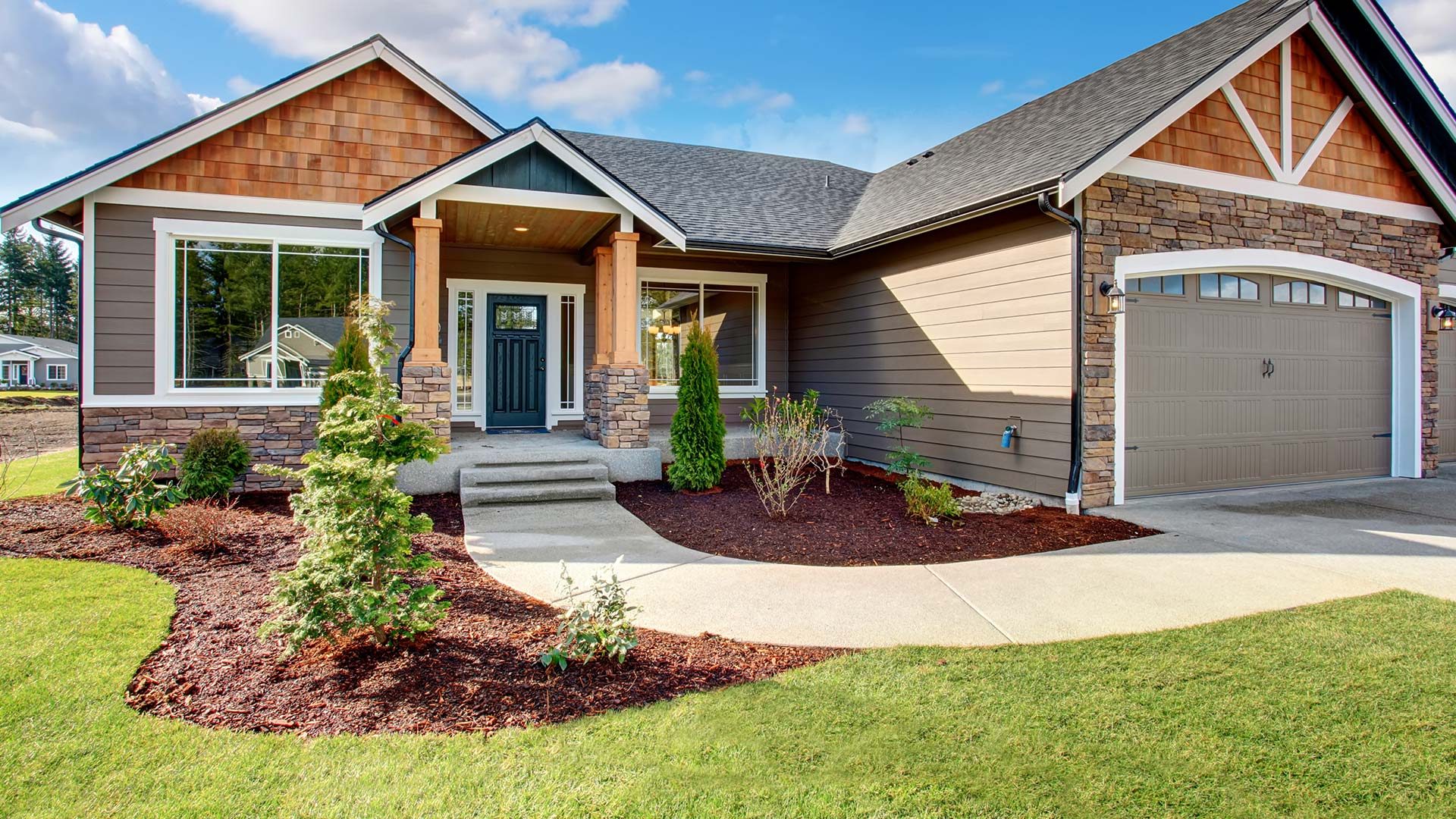 A newly constructed home with a lawn
