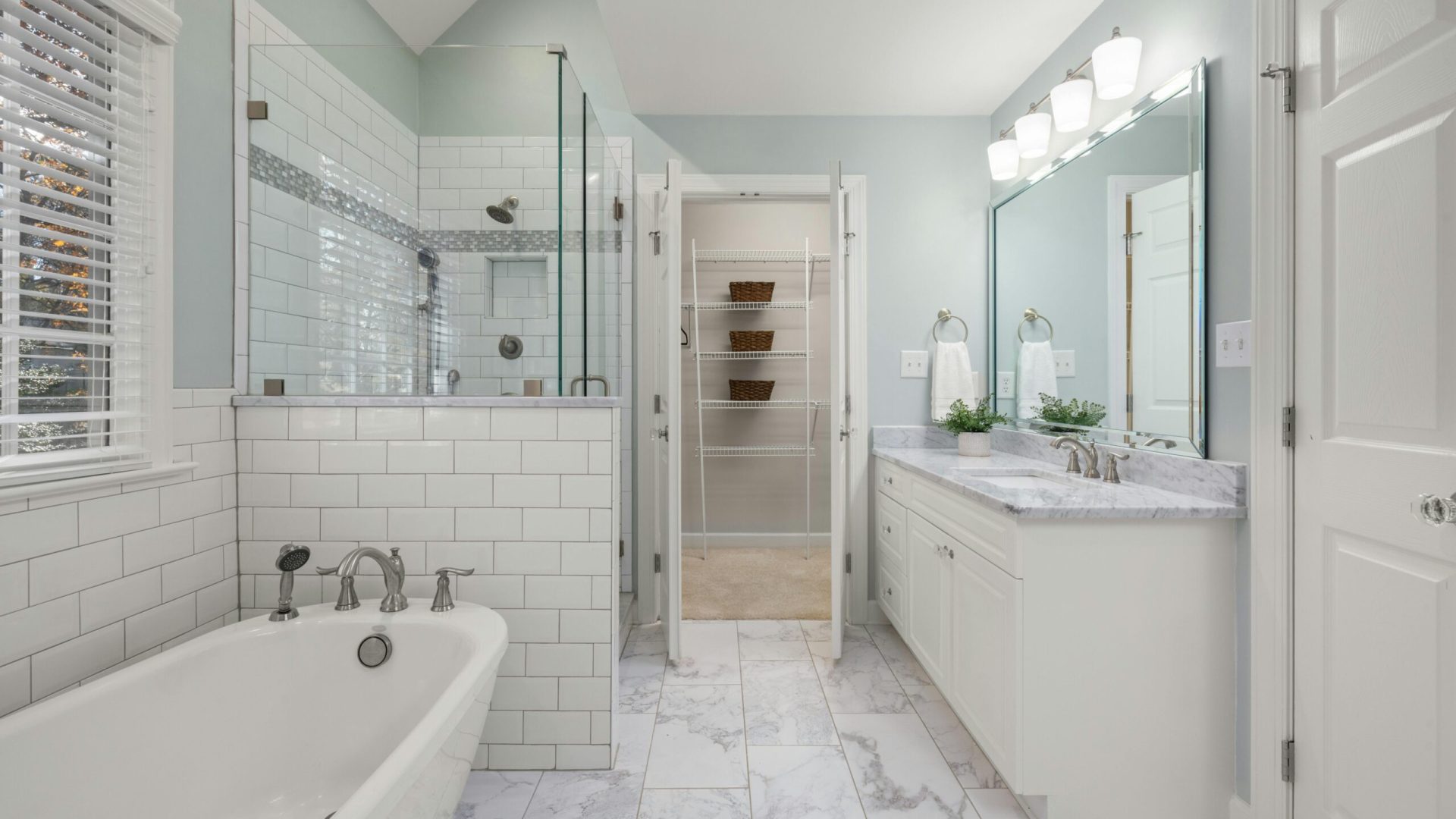 A modern white-marble bathroom