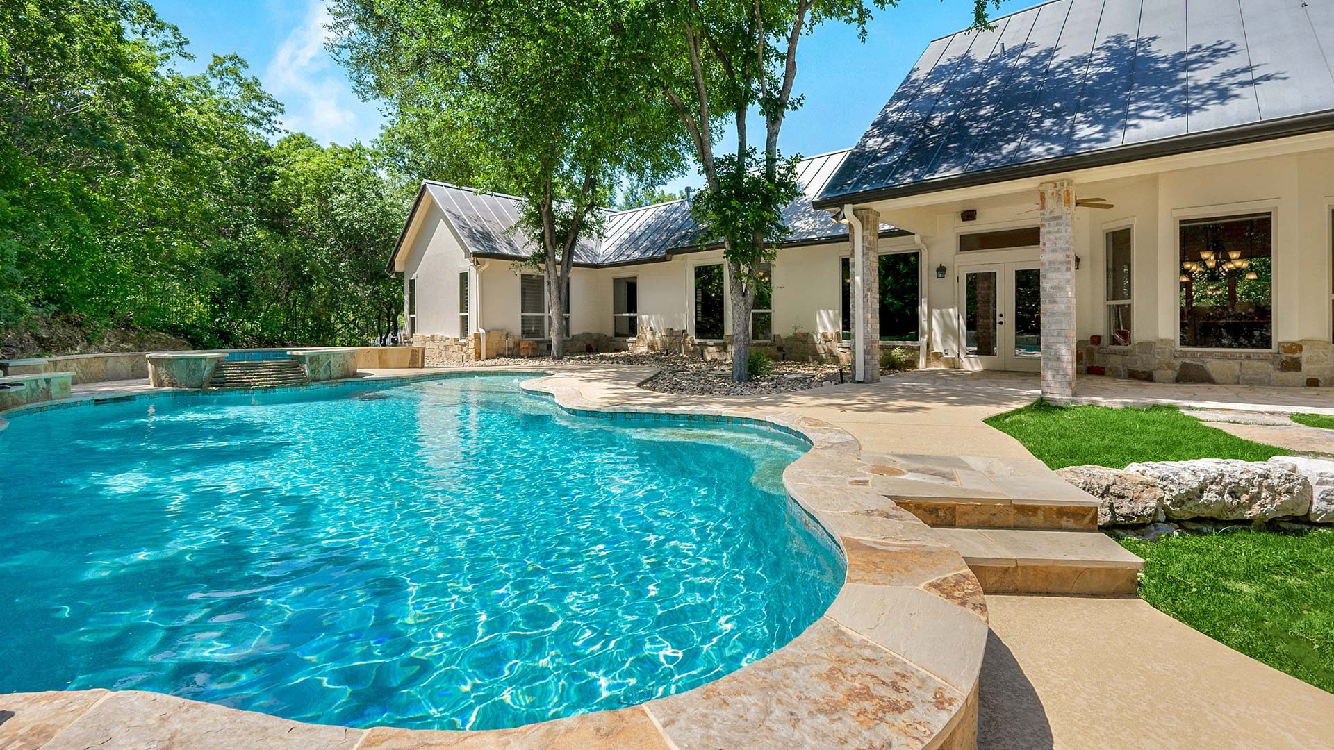 A beautiful white villa with a swimming pool